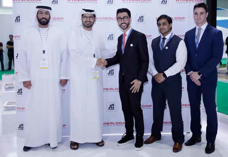Officials from Aldar and Hyperloop TT signed the MoU. Officials from Aldar and Hyperloop TT signed the MoU.