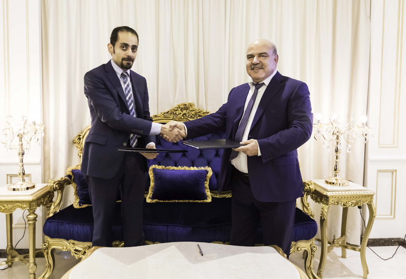 Mirwais Azizi (right) signed the 10-tower deal with Evershine Contracting. Mirwais Azizi (right) signed the 10-tower deal with Evershine Contracting.