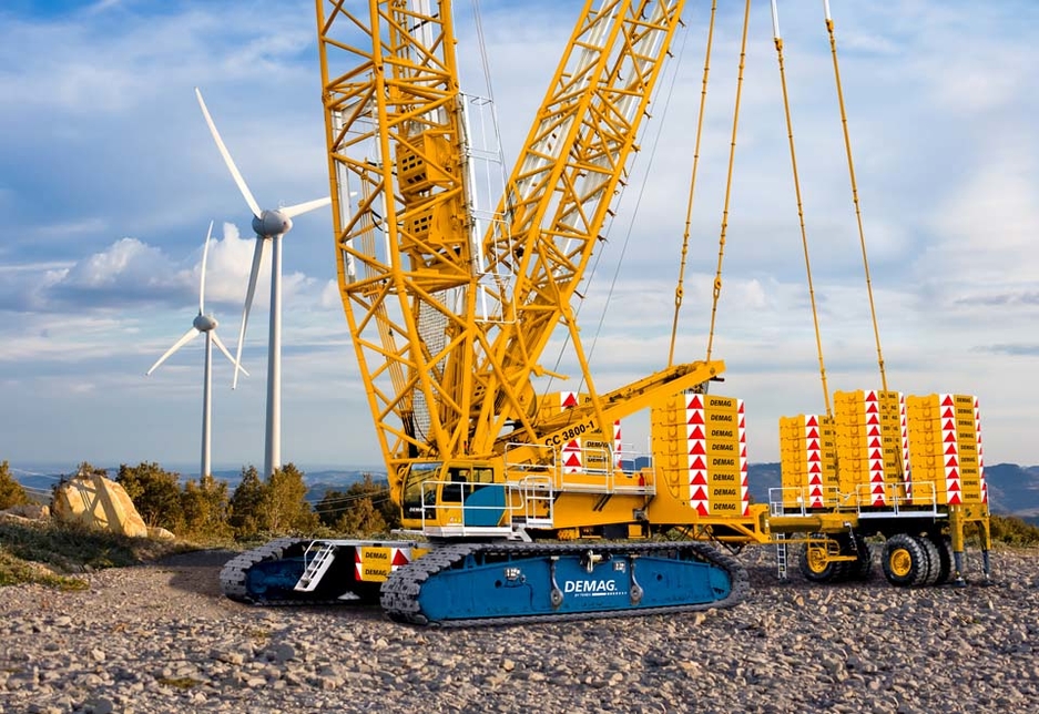 A Demag CC 3800-1 lattice boom crawler crane equipped with a Terex Boom Booster kit and Superlift for the purpose of wind turbine erection operations. A Demag CC 3800-1 lattice boom crawler crane equipped with a Terex Boom Booster kit and Superlift for the purpose of wind turbine erection operations.