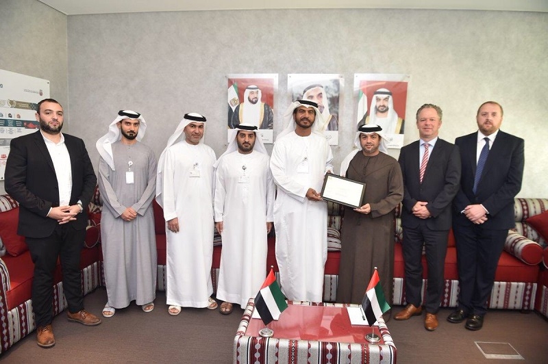 Representatives of the Abu Dhabi Quality and Conformity Council and Emirates Motor Company. Representatives of the Abu Dhabi Quality and Conformity Council and Emirates Motor Company.