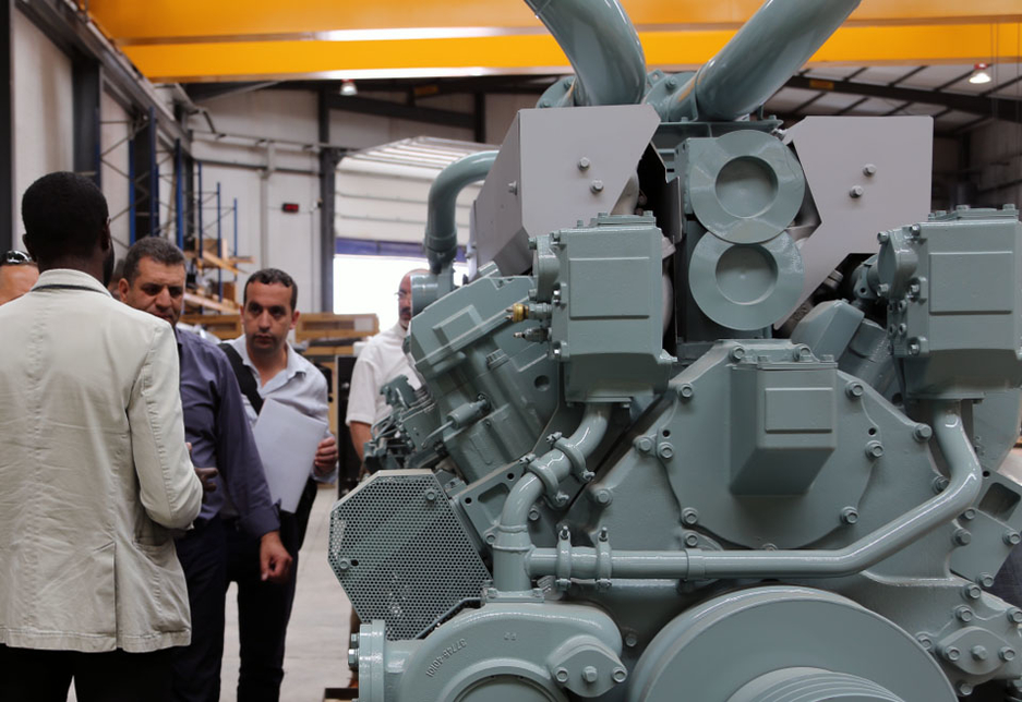 Visitors from the Algerian Ministry of the Environment inspect the installed standby generator set with the commissioning contractor SICE. Visitors from the Algerian Ministry of the Environment inspect the installed standby generator set with the commissioning contractor SICE.