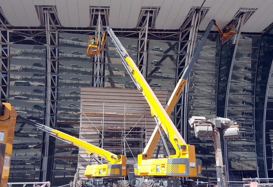 Haulotte H43TPX rough-terrain telescopic boom lifts support façade work on the King Abdulaziz International Airport terminals as part of the ongoing expansion work. Haulotte H43TPX rough-terrain telescopic boom lifts support façade work on the King Abdulaziz International Airport terminals as part of the ongoing expansion work.
