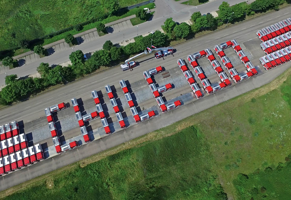 The order of 100 Magirus fire engines arrange to spell out 'Chile 100' in Germany. The order of 100 Magirus fire engines arrange to spell out 'Chile 100' in Germany.