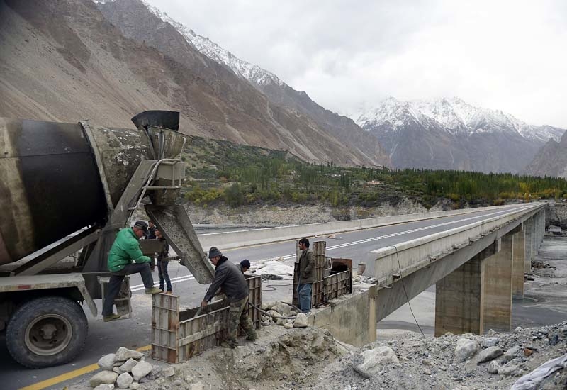 Chinese labourers work to shore up a stretch of the Karakoram highway in the Hunza valley in northern Pakistan. Chinese labourers work to shore up a stretch of the Karakoram highway in the Hunza valley in northern Pakistan.