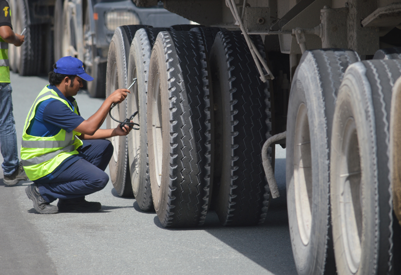 A technician checks a truck’s tyres in the campaign. A technician checks a truck’s tyres in the campaign.