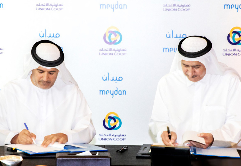 Al Shamsi and Saeed Humaid Al Tayer during the signing of the contract. Al Shamsi and Saeed Humaid Al Tayer during the signing of the contract.