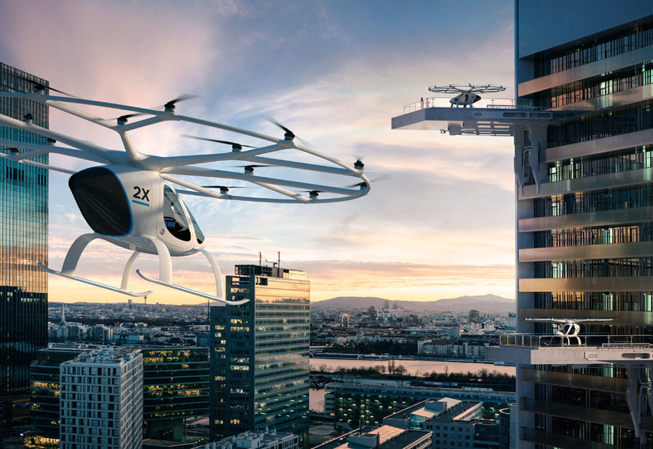A conceptual visualisation of the E-Volo 2X as a mode of transport in a high-rise urban environment. A conceptual visualisation of the E-Volo 2X as a mode of transport in a high-rise urban environment.