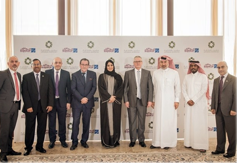 Dignitaries from Msheireb Properties and Mawaqif Qatar after the signing ceremony. Dignitaries from Msheireb Properties and Mawaqif Qatar after the signing ceremony.