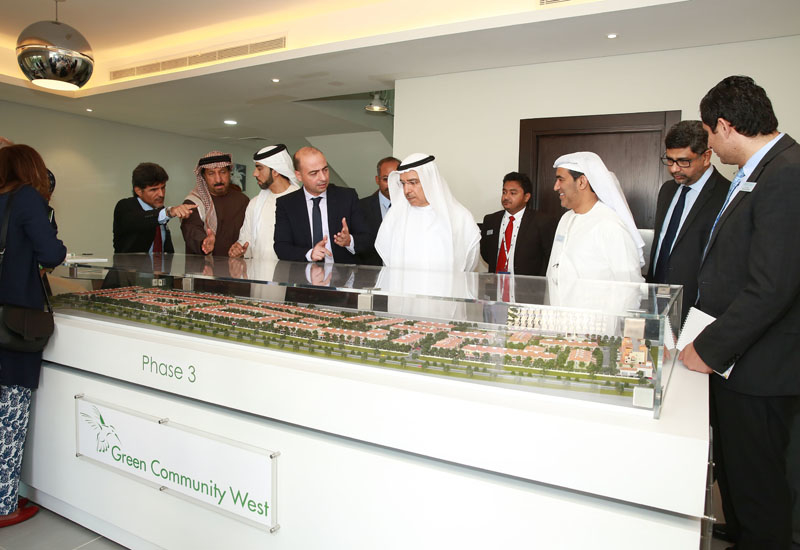 Khalid Bin Kalban and other officials viewing the model of Green Community West. Khalid Bin Kalban and other officials viewing the model of Green Community West.