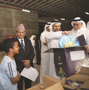 Gift boxes being packed for Nepalese construction workers in Qatar as part of a Ramadan charity initiative by Msheireb Properties. Gift boxes being packed for Nepalese construction workers in Qatar as part of a Ramadan charity initiative by Msheireb Properties.