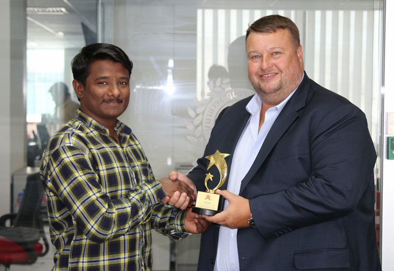 Nisham Kunnath Valappil (left) received a trophy from Greg Ward, managing director at Transguard Group (right). Nisham Kunnath Valappil (left) received a trophy from Greg Ward, managing director at Transguard Group (right).