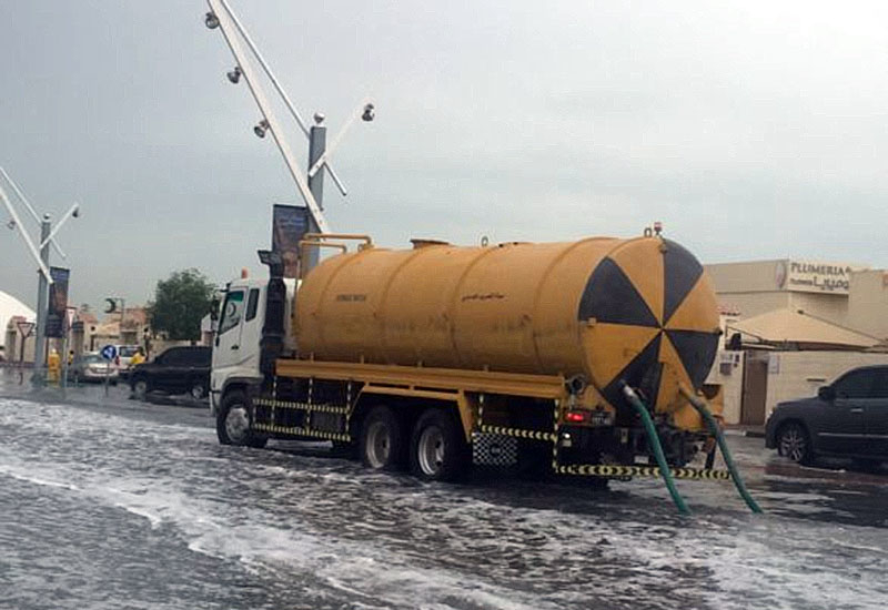 Truck removes rain water on Al Waab Street. (Lesley Walker) Truck removes rain water on Al Waab Street. (Lesley Walker)