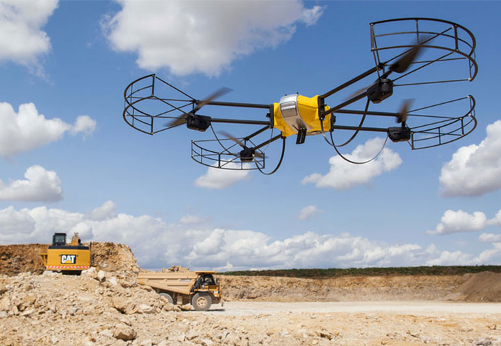 A Caterpillar UAV surveys a site. A Caterpillar UAV surveys a site.