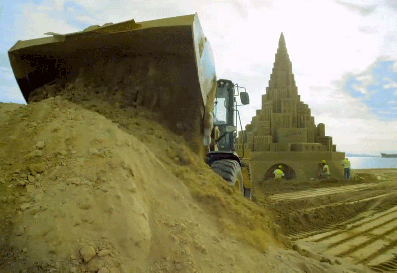 At a height of 12.59m, the Caterpillar-built sand castle has set a new Guinness World Record. At a height of 12.59m, the Caterpillar-built sand castle has set a new Guinness World Record.