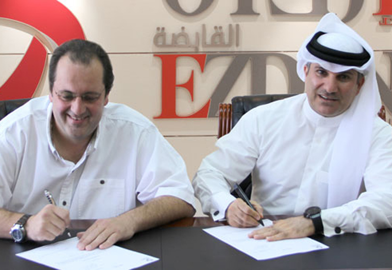 Officials signing the contract. Officials signing the contract.
