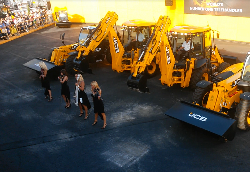 Six JCB machines joined forces with a string quartet to dance daily in front of the Las Vegas crowd. Six JCB machines joined forces with a string quartet to dance daily in front of the Las Vegas crowd.