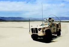 A JLVT prototype storms across sandy flat. A JLVT prototype storms across sandy flat.