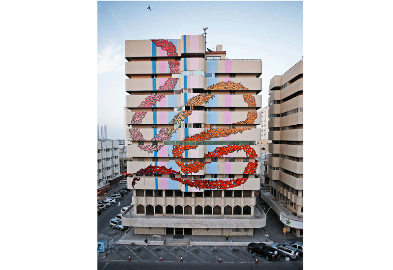 The French-Tunisian artist has developed a style known as 'calligraffiti' which fuses graffiti and Arabic traditional script. The French-Tunisian artist has developed a style known as 'calligraffiti' which fuses graffiti and Arabic traditional script.