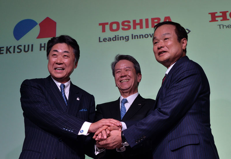L-R: Sekisui House president Toshinori Abe with Toshiba president Hisao Tanaka and Honda Motors' Takanobu Ito (Photo: Yoshikazu Tsuno/AFP/Getty Image L-R: Sekisui House president Toshinori Abe with Toshiba president Hisao Tanaka and Honda Motors' Takanobu Ito (Photo: Yoshikazu Tsuno/AFP/Getty Image