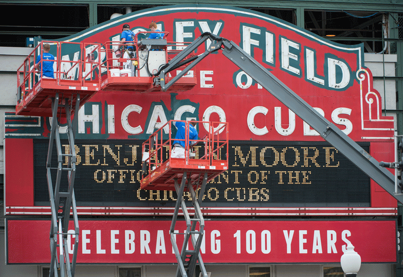 The iconic ballpark's giant marquee has been restored to its original green and gold to celebrate the Chicago Cubs' centenary. The iconic ballpark's giant marquee has been restored to its original green and gold to celebrate the Chicago Cubs' centenary.