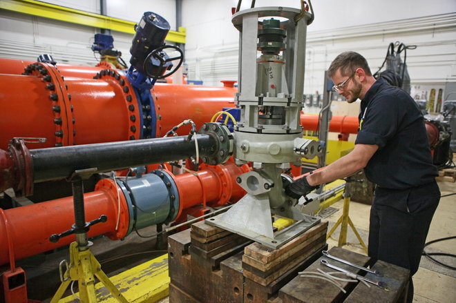 An assembly technician works on Xylem equipment at a production facility. An assembly technician works on Xylem equipment at a production facility.