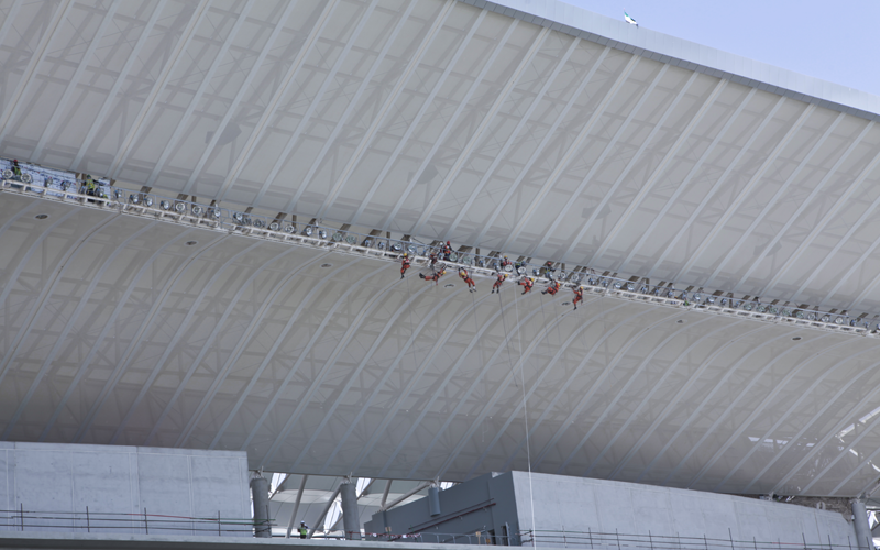 Specialist rope technicians from sub-contractor Megarme were drafted in to work on the "ring of fire" floodlighting system. Specialist rope technicians from sub-contractor Megarme were drafted in to work on the "ring of fire" floodlighting system.