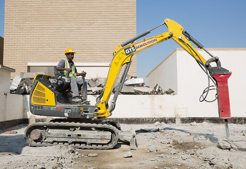 An employee of GTS Demolition gets to work with a Chicago Pneumatic breaker. An employee of GTS Demolition gets to work with a Chicago Pneumatic breaker.