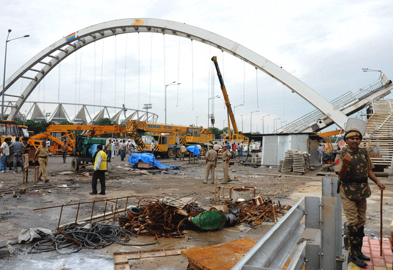 The aftermath of the bridge collapse at the New Delhi Commonwealth Games site. Picture: Getty. The aftermath of the bridge collapse at the New Delhi Commonwealth Games site. Picture: Getty.