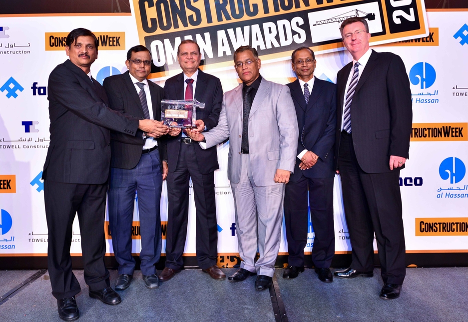 DC Munshi led the Bahwan Contracting Company team collecting the prize from Paul Floyd of FAMCO. DC Munshi led the Bahwan Contracting Company team collecting the prize from Paul Floyd of FAMCO.