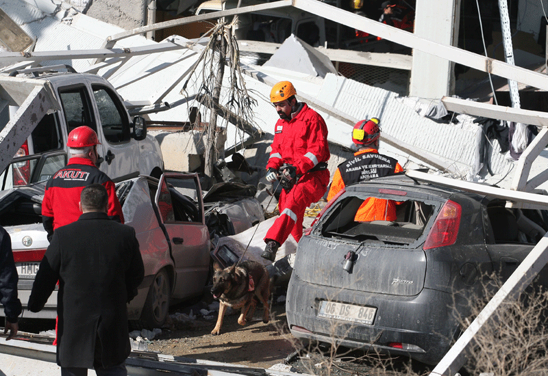 Rescue workers search for survivors (STR/AFP/Getty Images) Rescue workers search for survivors (STR/AFP/Getty Images)