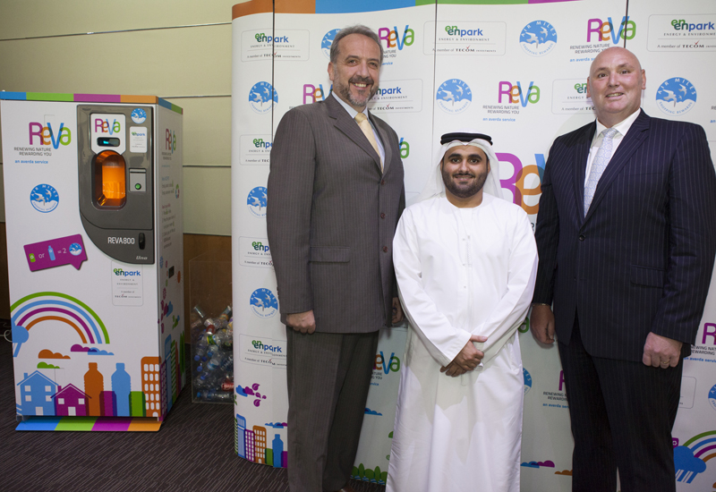 The ReVa machine flanked by Mark Mortimer-Davies, CEO of Air Miles Middle East, Saeed bin Ghubash, director of Enpark, TECOM, and John Irvine, managin The ReVa machine flanked by Mark Mortimer-Davies, CEO of Air Miles Middle East, Saeed bin Ghubash, director of Enpark, TECOM, and John Irvine, managin