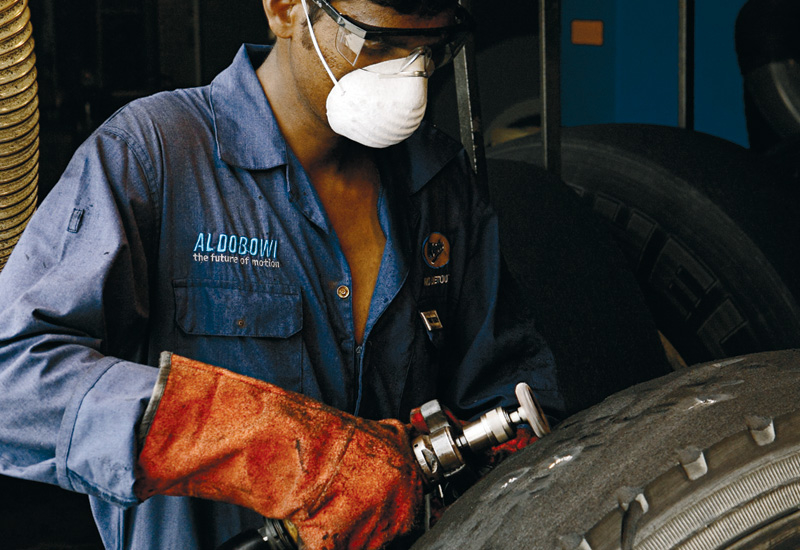 Removing tread impurities and preparing the carcass is a hands on job. Removing tread impurities and preparing the carcass is a hands on job.