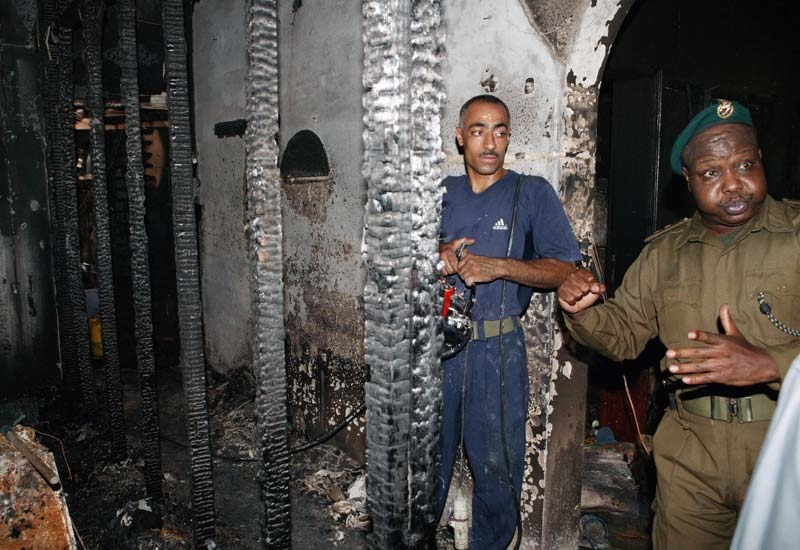Firemen inspect the building following the blaze on July 30, 2006. (Getty Images) Firemen inspect the building following the blaze on July 30, 2006. (Getty Images)