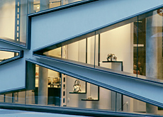 Wedge-shaped glass facade. Wedge-shaped glass facade.