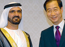 His Highness Sheikh Mohammad bin Rashid Al Maktoum (left) shakes hands with his South Korean counterpart Han Duck-Soo (right) during their meeting in His Highness Sheikh Mohammad bin Rashid Al Maktoum (left) shakes hands with his South Korean counterpart Han Duck-Soo (right) during their meeting in