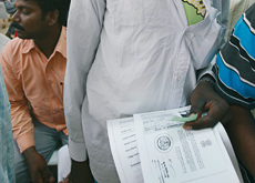 An illegal construction worker collects his emergency certificate at a makeshift amnesty centre in Dubai. (Valeriano Handumon/ITP Images) An illegal construction worker collects his emergency certificate at a makeshift amnesty centre in Dubai. (Valeriano Handumon/ITP Images)