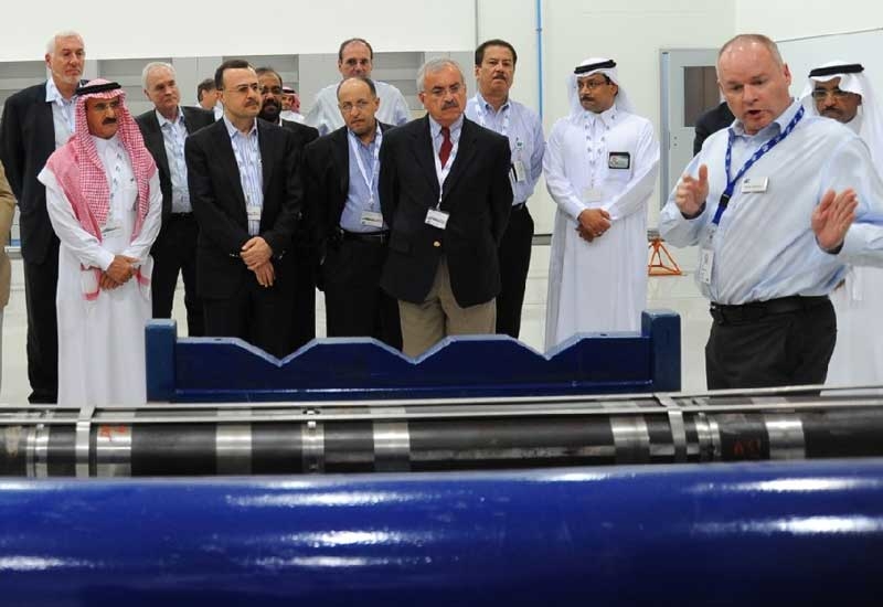 Staff and guests at the opening of the new Baker Hughes facility in Saudi Arabia. Staff and guests at the opening of the new Baker Hughes facility in Saudi Arabia.