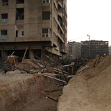 The scaffolding that collapsed was directly above the excavated services trench. Vibrations from drilling has been said to have caused the collapse. The scaffolding that collapsed was directly above the excavated services trench. Vibrations from drilling has been said to have caused the collapse.