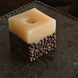 Interesting accessories abound in the showhome, like this candle decorated with coffee beans. Interesting accessories abound in the showhome, like this candle decorated with coffee beans.