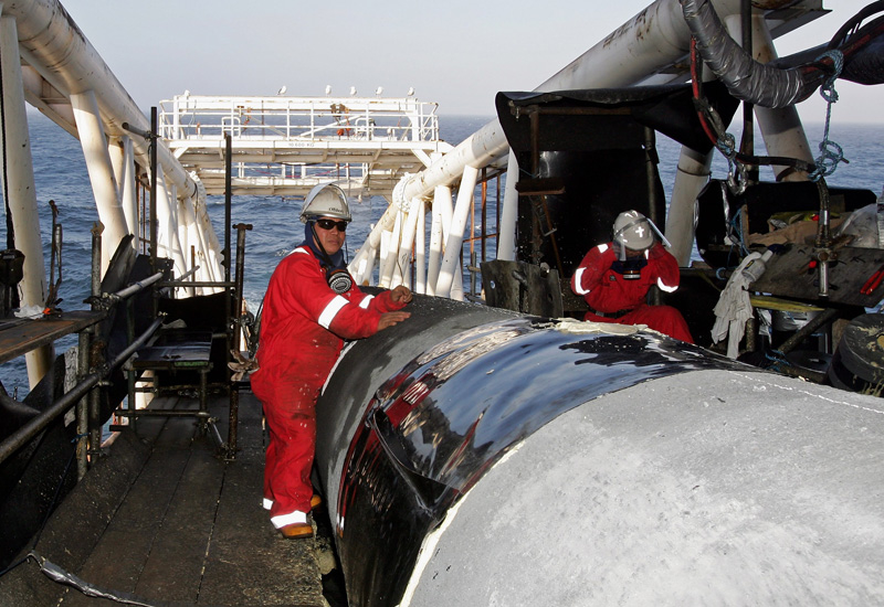 Workers make final preparations to pipes, as they enter the sea from the pipelay vessel Acergy Piper, to form part of the 1200km Langeled pipeline. Workers make final preparations to pipes, as they enter the sea from the pipelay vessel Acergy Piper, to form part of the 1200km Langeled pipeline.
