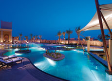 Rounded shapes are popular in completed pools. (Outdoor pool at Banyan Tree Al Areen Rounded shapes are popular in completed pools. (Outdoor pool at Banyan Tree Al Areen
