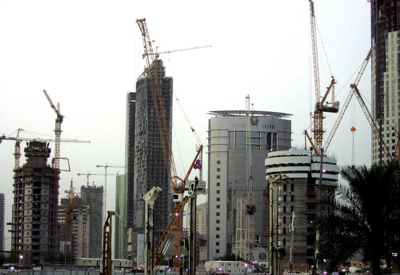 GOING UP Cranes dominate the Doha skyline. GOING UP Cranes dominate the Doha skyline.