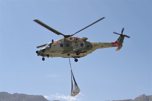 Construction materials were air-lifted to remote areas of Oman. Construction materials were air-lifted to remote areas of Oman.